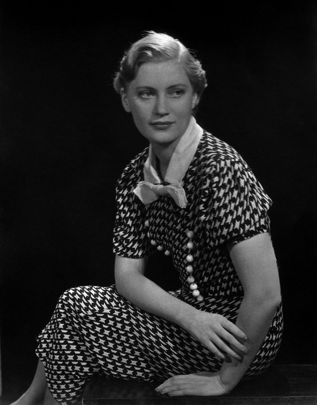 Self portrait in black and white patterned dress